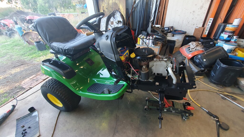 partly reassembled ride on mower