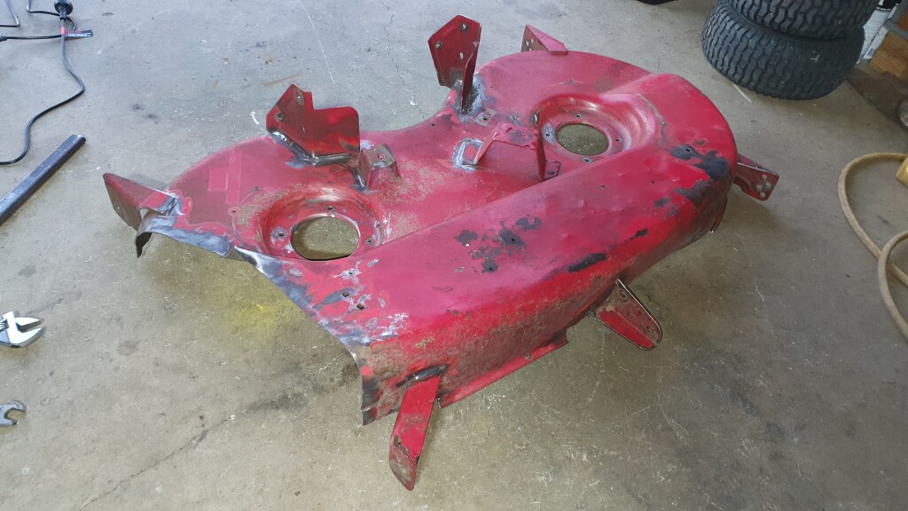 Damaged mower cutting deck