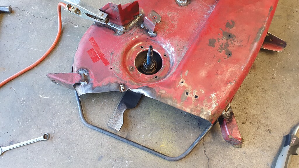 Repaired mower deck chute