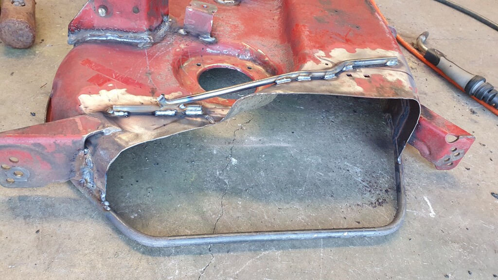 repaired and braced mower deck chute