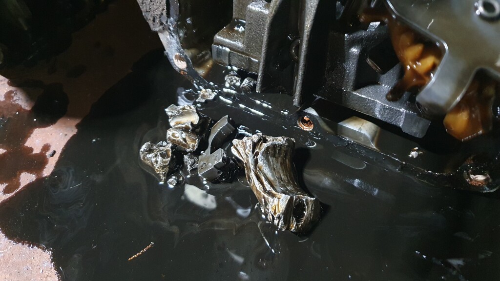 mower engine with damaged parts inside